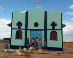 New-church-was-built-in-a-remote-area-of-St.-Jude-Catholic-Parish.-Fr.-Ernesto-and-youth-group-member-painting-the-new-building