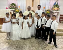 Fr. Rudy and Fr. Jordanio with the communicants of the parish.